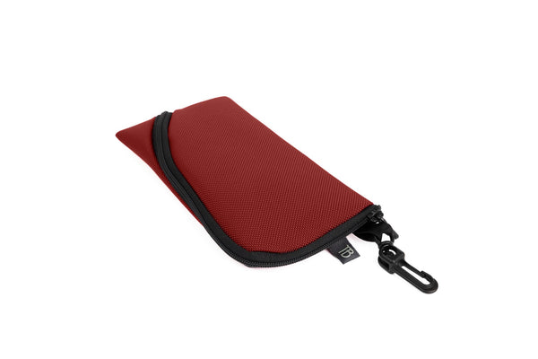 A Small Ghost Whale Pouch in Mars Red (brick red).